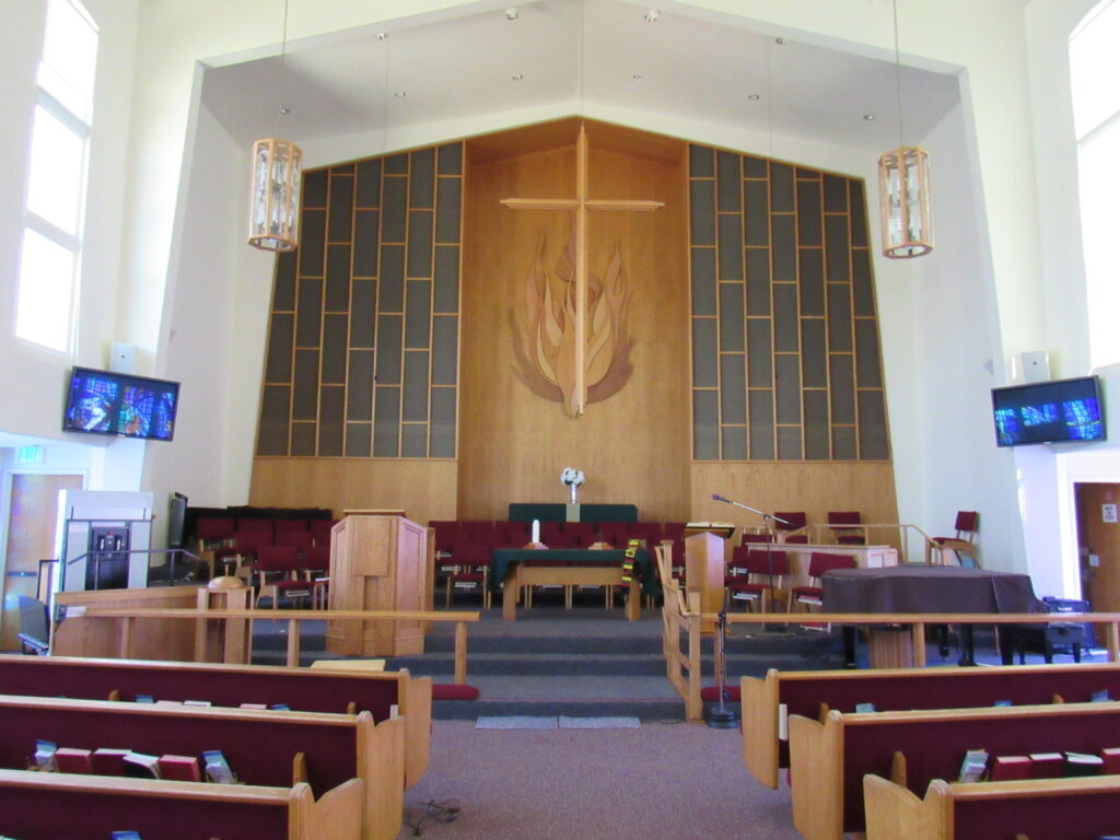 main church with pews, stained glass,