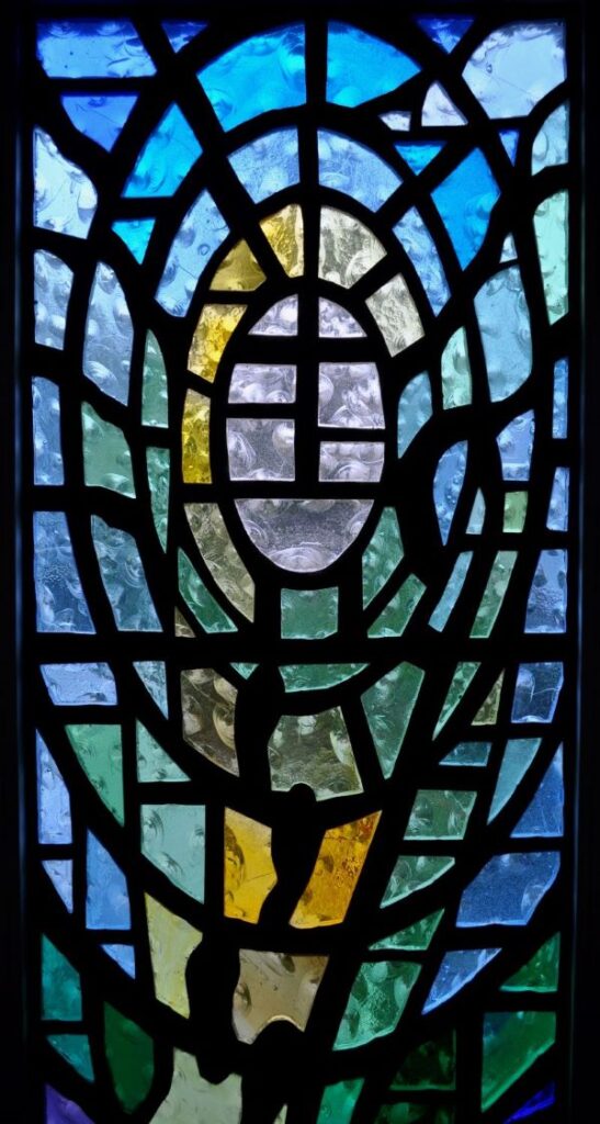 Stained glass window of a valley representing the Psalm 23 Valley of the Shadow of Death