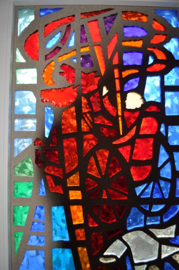 Stained glass window of a chariot on fire representative of the 2 Kings story of Elijah and the Chariot of Fire